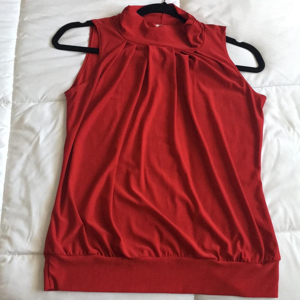 Red turtle neck sleeveless Top.